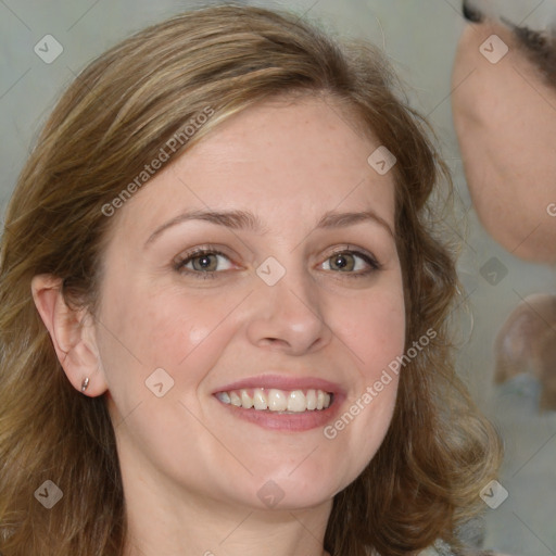 Joyful white young-adult female with medium  brown hair and blue eyes