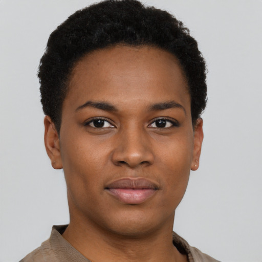 Joyful black young-adult female with short  black hair and brown eyes