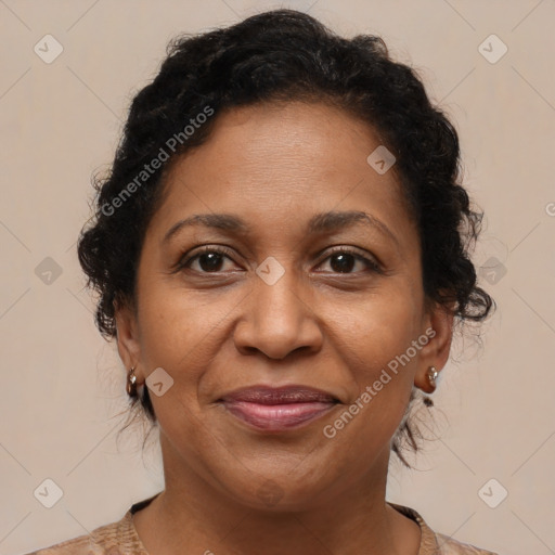 Joyful black adult female with medium  brown hair and brown eyes