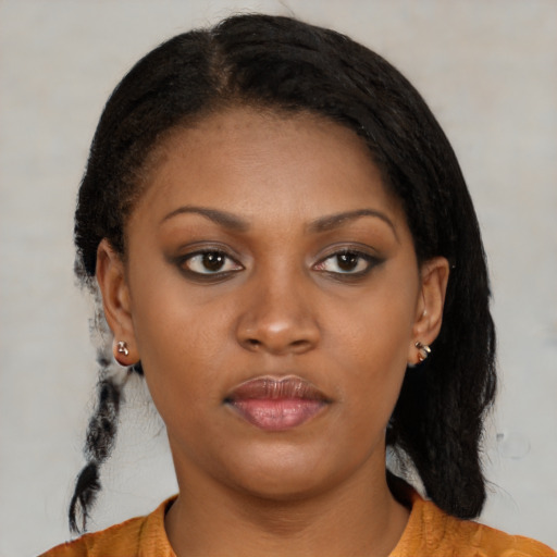 Neutral black young-adult female with medium  brown hair and brown eyes