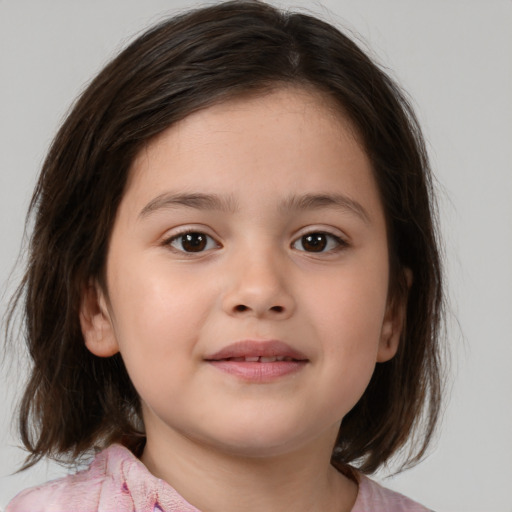 Joyful white child female with medium  brown hair and brown eyes