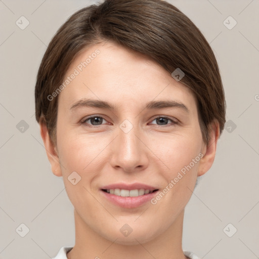 Joyful white young-adult female with short  brown hair and grey eyes