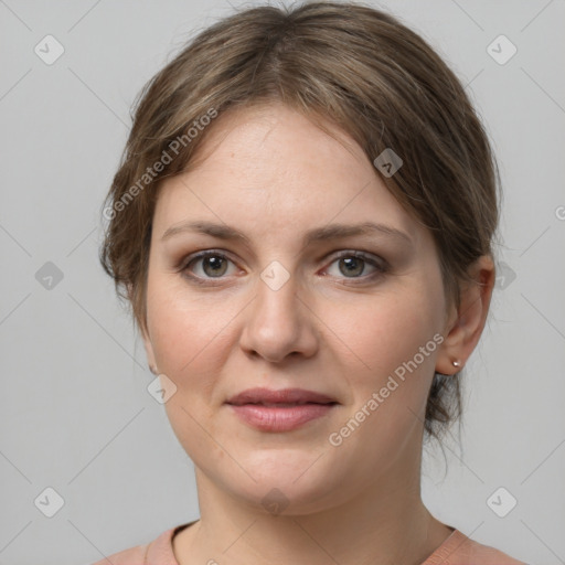 Joyful white young-adult female with medium  brown hair and grey eyes