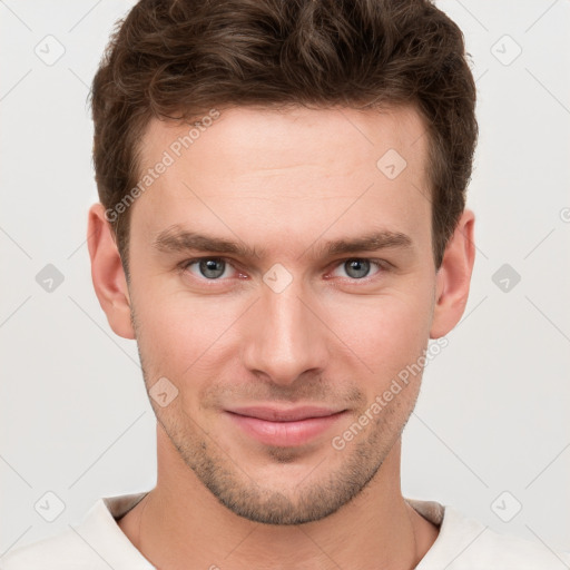 Joyful white young-adult male with short  brown hair and grey eyes