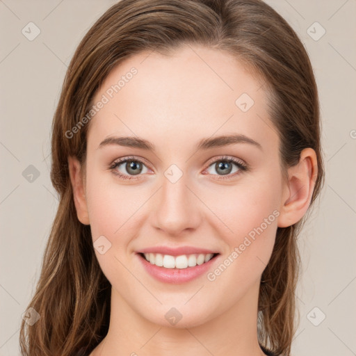 Joyful white young-adult female with long  brown hair and green eyes