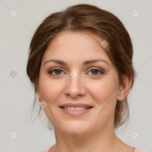 Joyful white young-adult female with medium  brown hair and green eyes