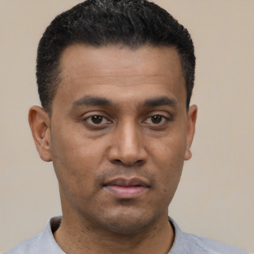 Neutral latino young-adult male with short  black hair and brown eyes