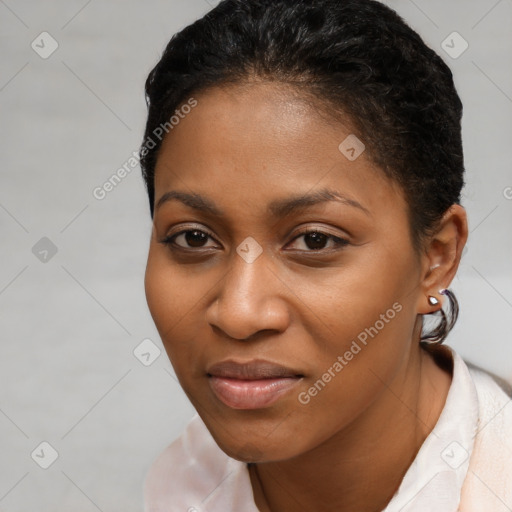 Joyful black young-adult female with short  brown hair and brown eyes