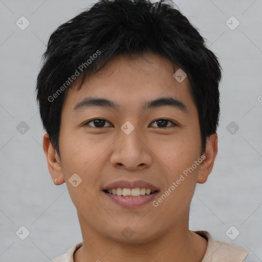 Joyful asian young-adult male with short  brown hair and brown eyes