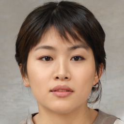 Neutral asian young-adult female with medium  brown hair and brown eyes