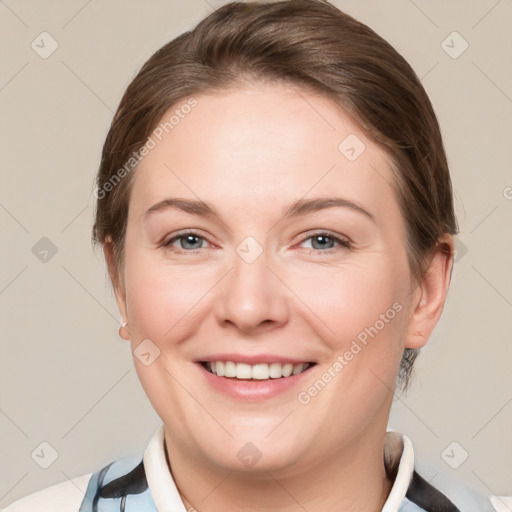 Joyful white adult female with medium  brown hair and grey eyes