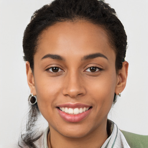 Joyful latino young-adult female with short  brown hair and brown eyes