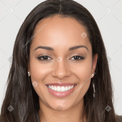 Joyful latino young-adult female with long  brown hair and brown eyes