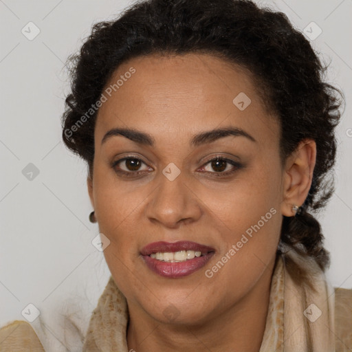 Joyful black young-adult female with long  brown hair and brown eyes