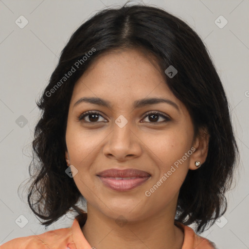 Joyful latino young-adult female with medium  brown hair and brown eyes