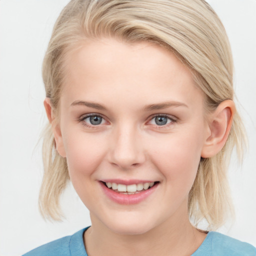 Joyful white young-adult female with medium  brown hair and blue eyes