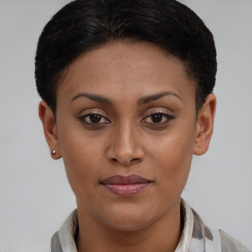 Joyful latino young-adult female with short  brown hair and brown eyes