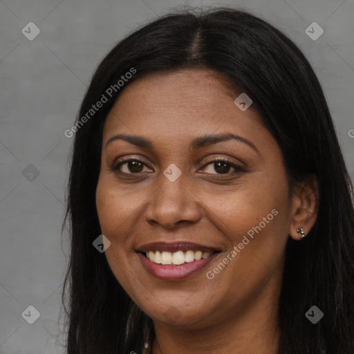 Joyful black young-adult female with long  brown hair and brown eyes