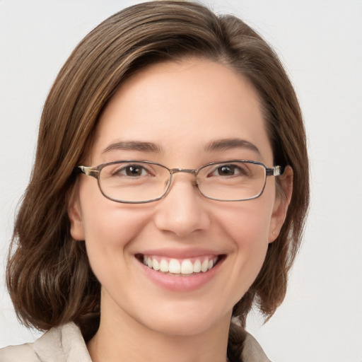 Joyful white young-adult female with medium  brown hair and grey eyes