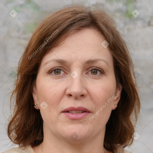 Joyful white adult female with medium  brown hair and grey eyes