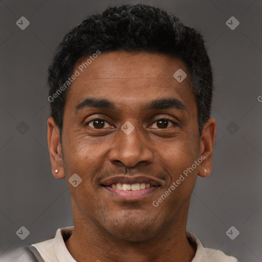 Joyful latino young-adult male with short  black hair and brown eyes