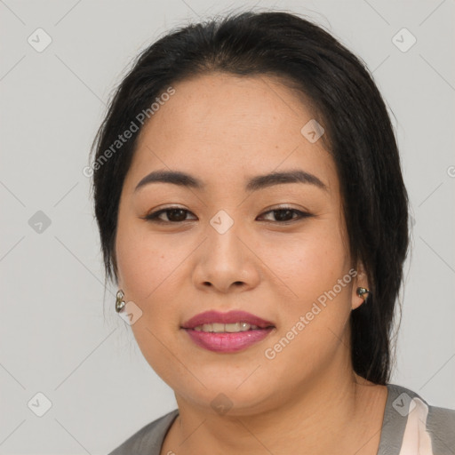 Joyful asian young-adult female with medium  black hair and brown eyes