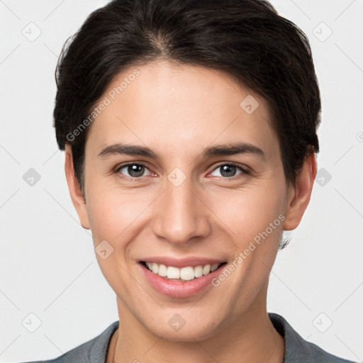 Joyful white young-adult female with short  brown hair and brown eyes