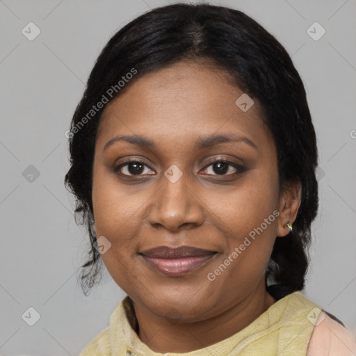 Joyful black adult female with medium  black hair and brown eyes