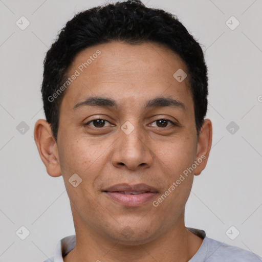 Joyful latino adult male with short  black hair and brown eyes