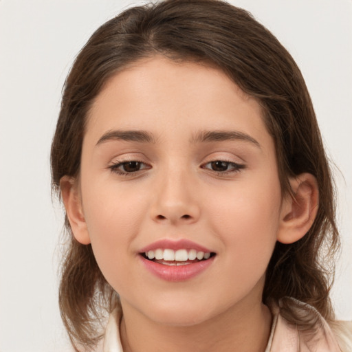 Joyful white child female with medium  brown hair and brown eyes