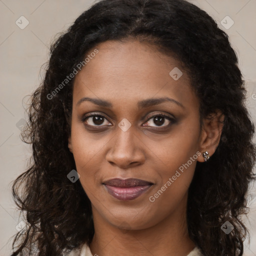 Joyful black young-adult female with long  brown hair and brown eyes