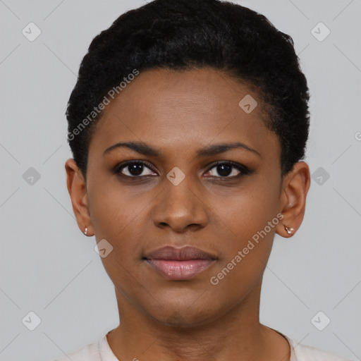 Joyful black young-adult female with short  black hair and brown eyes