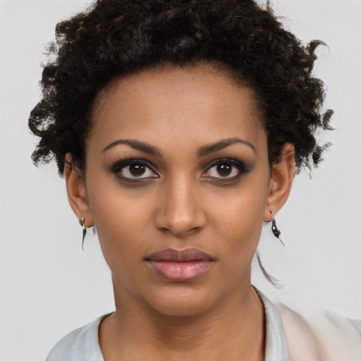 Neutral black young-adult female with short  brown hair and brown eyes