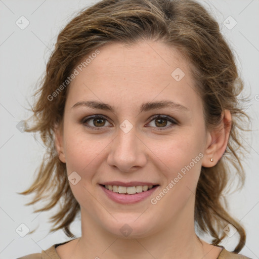 Joyful white young-adult female with medium  brown hair and green eyes