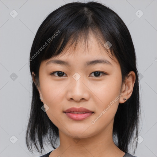 Joyful asian young-adult female with medium  black hair and brown eyes