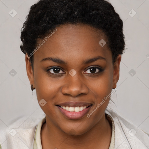 Joyful black young-adult female with short  brown hair and brown eyes