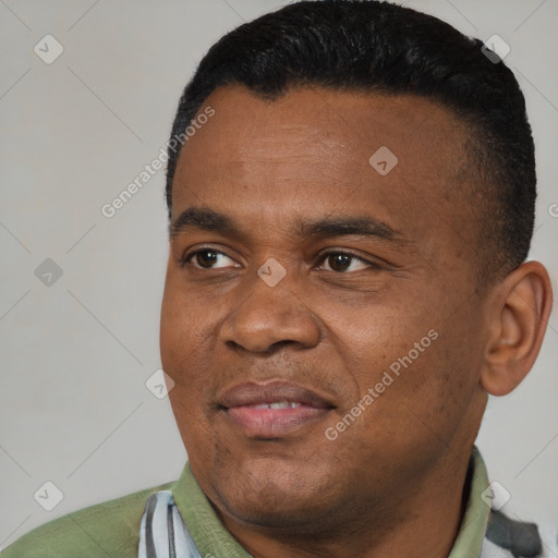 Joyful black young-adult male with short  black hair and brown eyes