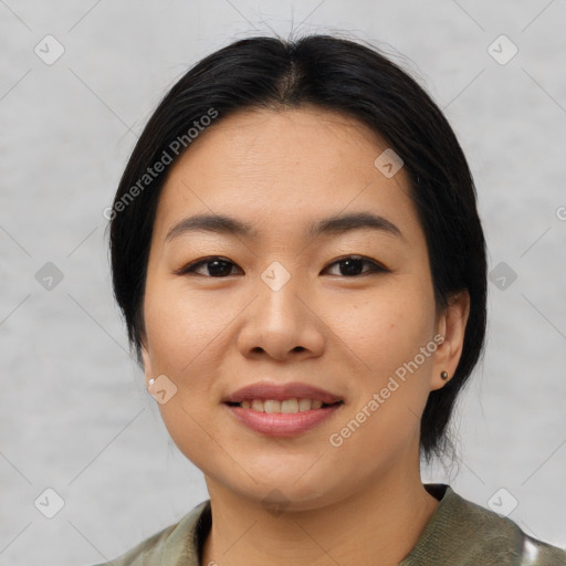 Joyful asian young-adult female with medium  black hair and brown eyes