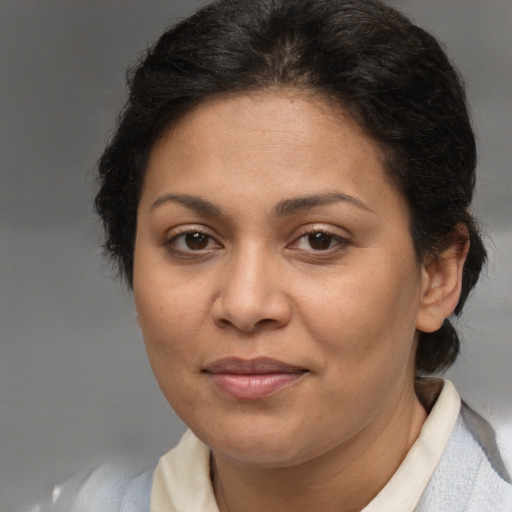 Joyful white adult female with medium  brown hair and brown eyes