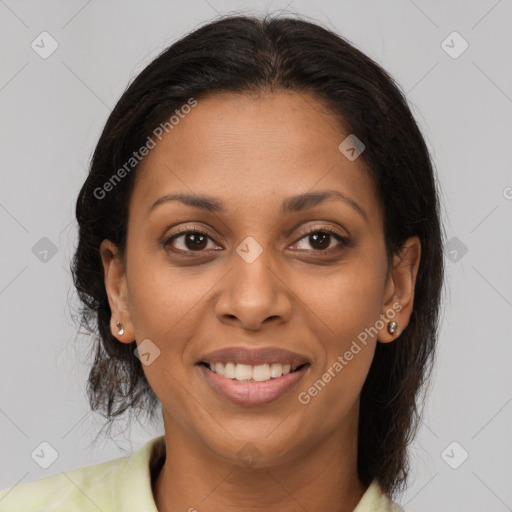 Joyful black young-adult female with medium  brown hair and brown eyes