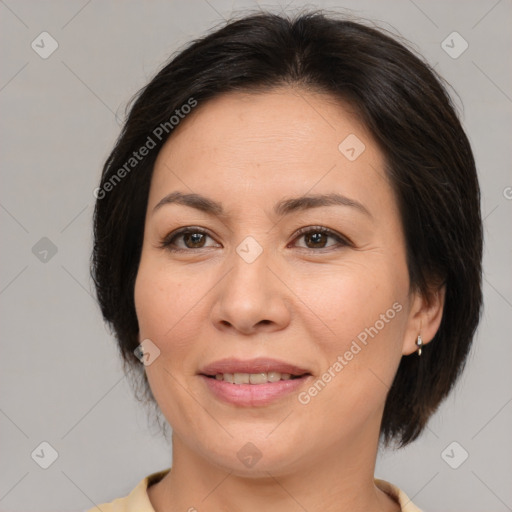 Joyful white adult female with medium  brown hair and brown eyes