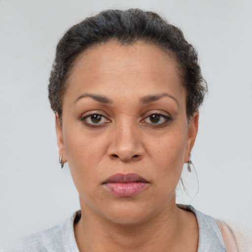 Neutral latino adult female with short  brown hair and brown eyes