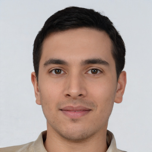 Joyful asian young-adult male with short  black hair and brown eyes