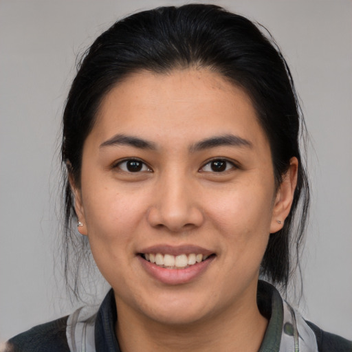 Joyful white young-adult female with medium  brown hair and brown eyes