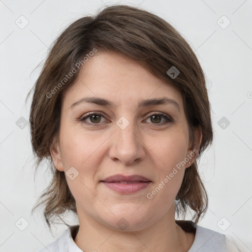 Joyful white adult female with medium  brown hair and grey eyes