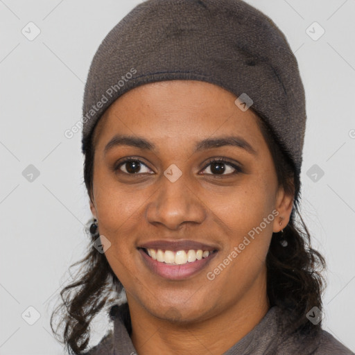 Joyful black young-adult female with medium  black hair and brown eyes