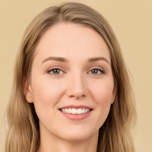 Joyful white young-adult female with long  brown hair and grey eyes