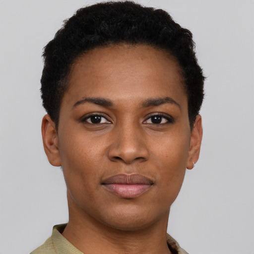 Joyful black young-adult female with short  black hair and brown eyes