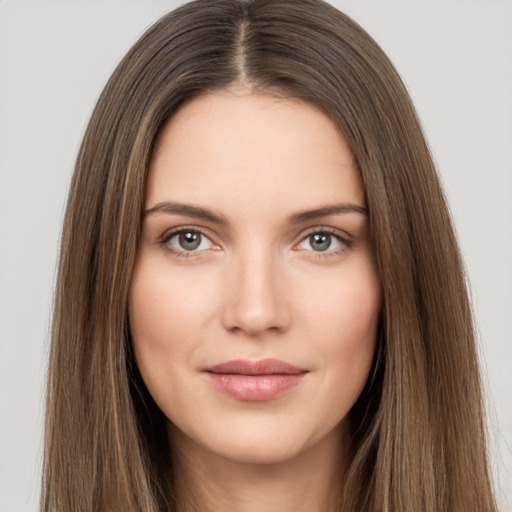 Neutral white young-adult female with long  brown hair and brown eyes