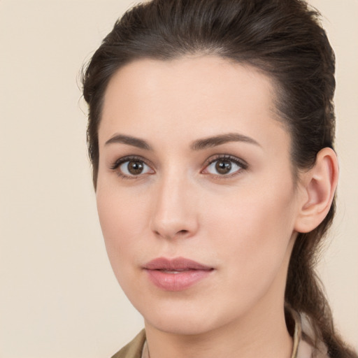 Neutral white young-adult female with medium  brown hair and brown eyes